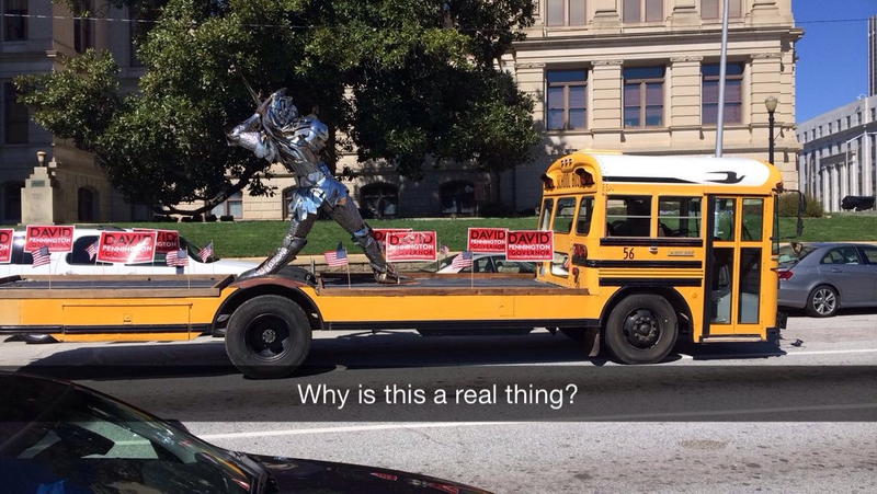 Illustration for article titled Flat-Bed School Bus Carries Chrome Knight, Political Message Around GA